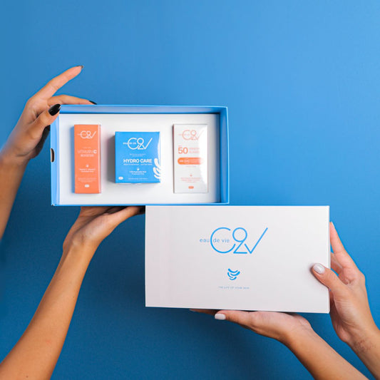 A skincare set gift that contains moisturizer, vitamin c serum, and sunscreen